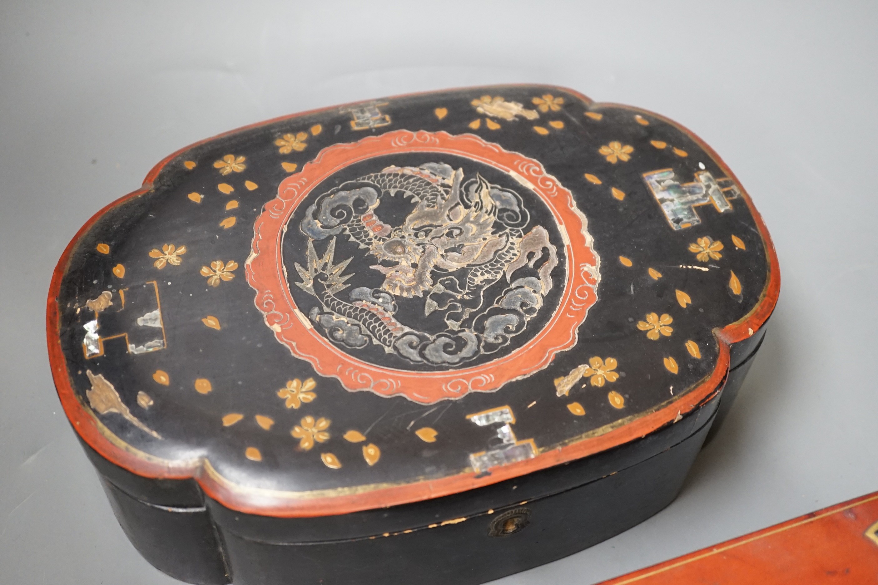 A French leather mounted serpentine glove box and a Japanese lacquer box. Largest 26.5cm wide